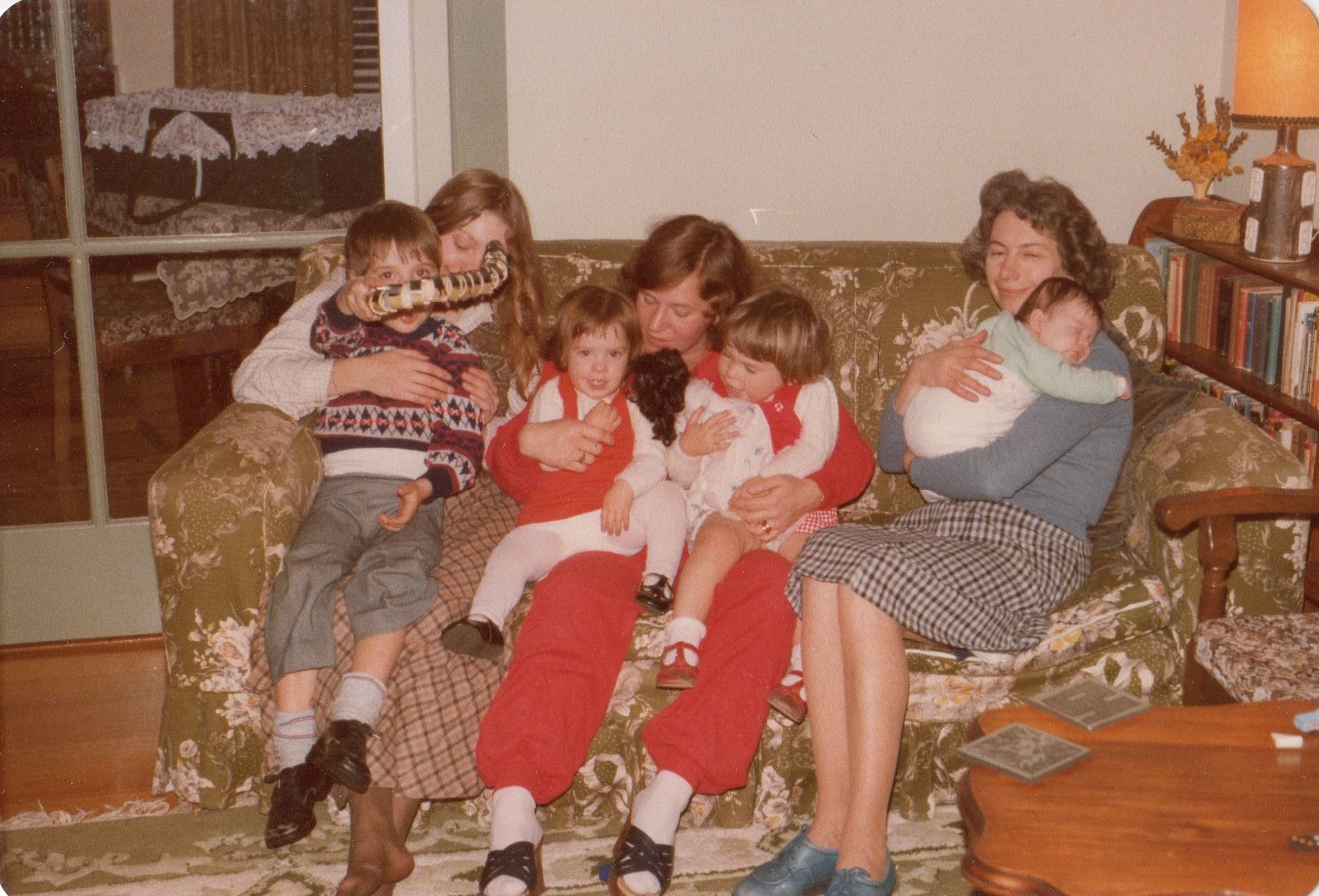 Shell cuddling niece Theresa, with James, Linda and Chrissy, 1982